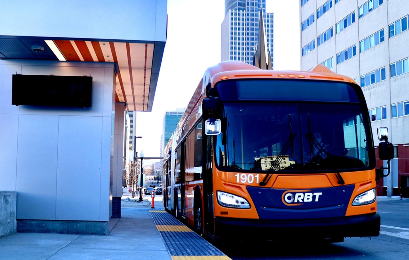 Orange and Blue colored bus in the city of Omaha.